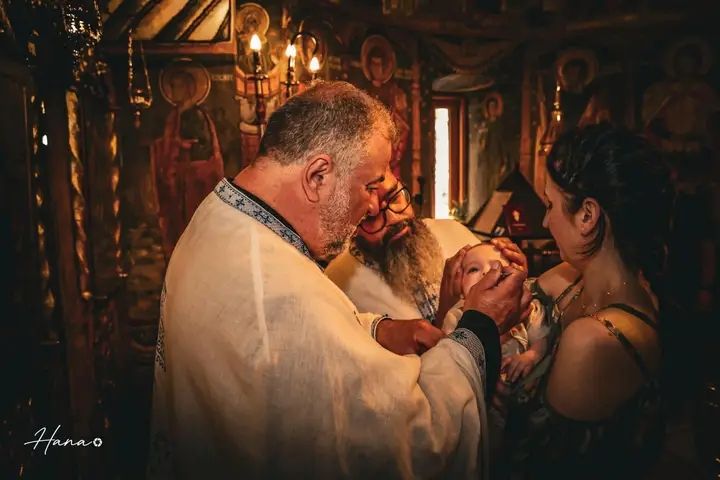 Candlelit baptism ceremony in a warm church